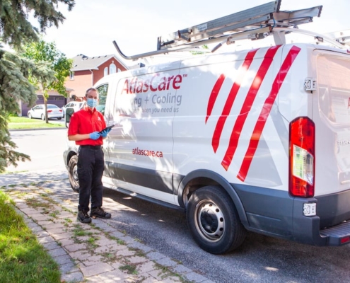 technician standing infront of AtlasCare truck