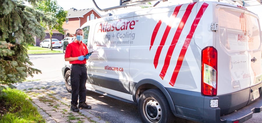 technician standing infront of AtlasCare truck